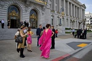 Hailing a cab outside City Hall