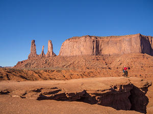Cowboy photo op and Monument Valley's Three Sisters